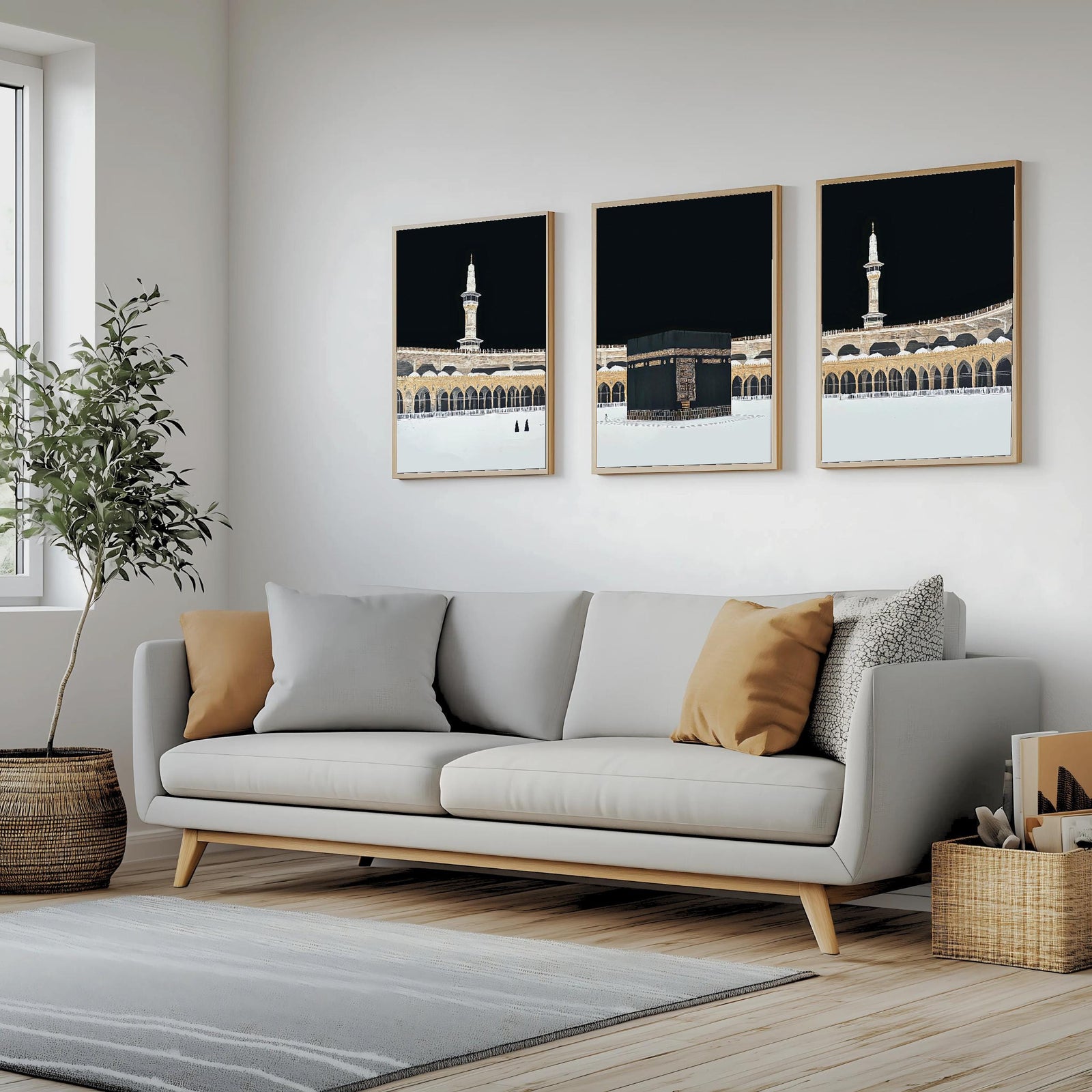 Set of 3 framed canvas triptych showing dramatic night views of Masjid Al-Haram with the Kaaba centered, glowing gold minarets and white marble courtyard against a deep black sky, displayed above a neutral sofa.