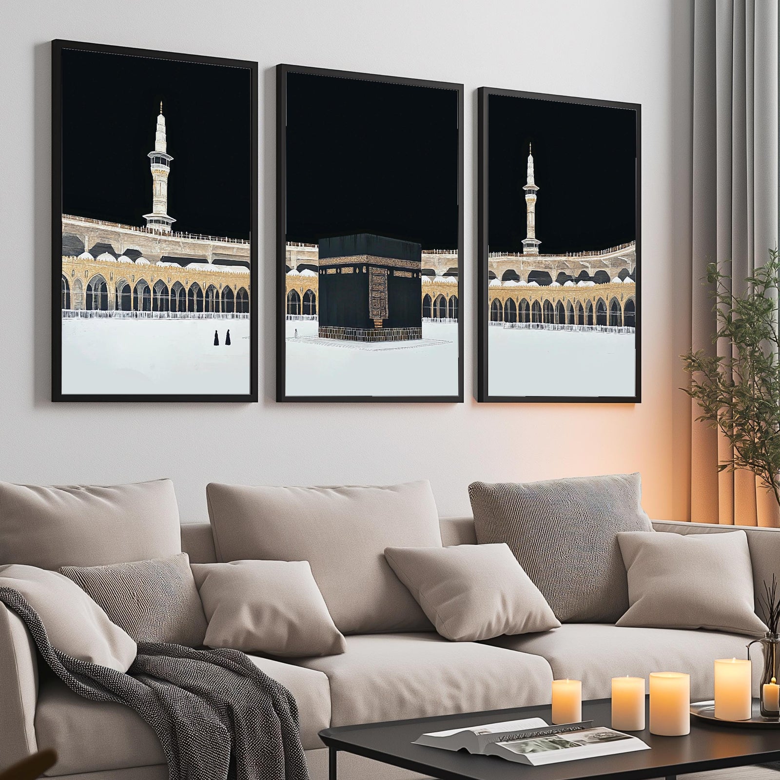 Set of 3 framed canvas triptych showing dramatic night views of Masjid Al-Haram with the Kaaba centered, glowing gold minarets and white marble courtyard against a deep black sky, displayed above a neutral sofa.