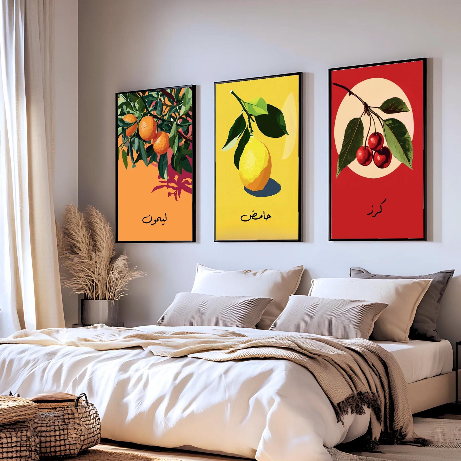 Set of 3 framed canvas triptych featuring bold retro illustrations of orange, lemon and cherry with Arabic calligraphy labels on vibrant orange, yellow and red backgrounds, displayed above a neutral sofa.