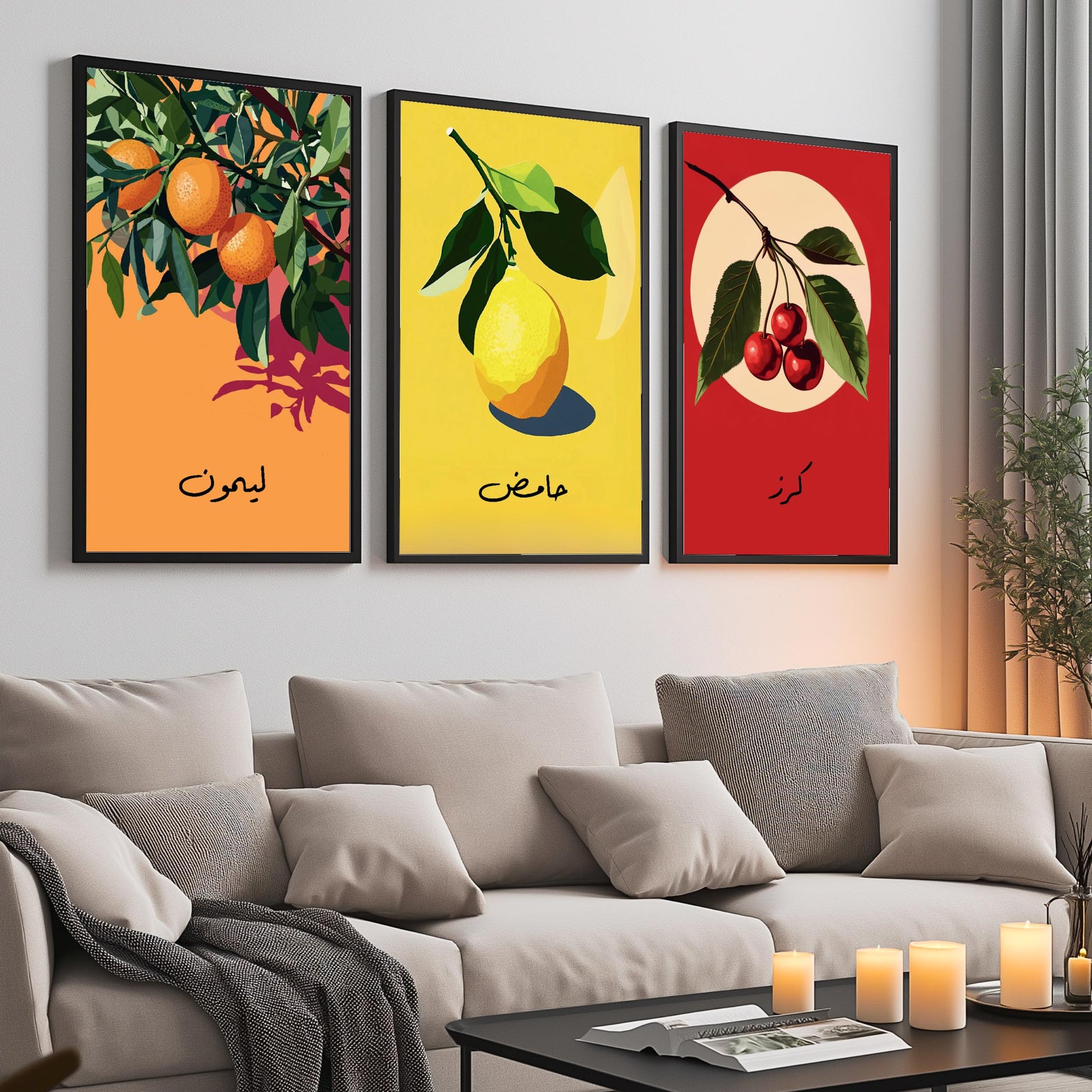Set of 3 framed canvas triptych featuring bold retro illustrations of orange, lemon and cherry with Arabic calligraphy labels on vibrant orange, yellow and red backgrounds, displayed above a neutral sofa.