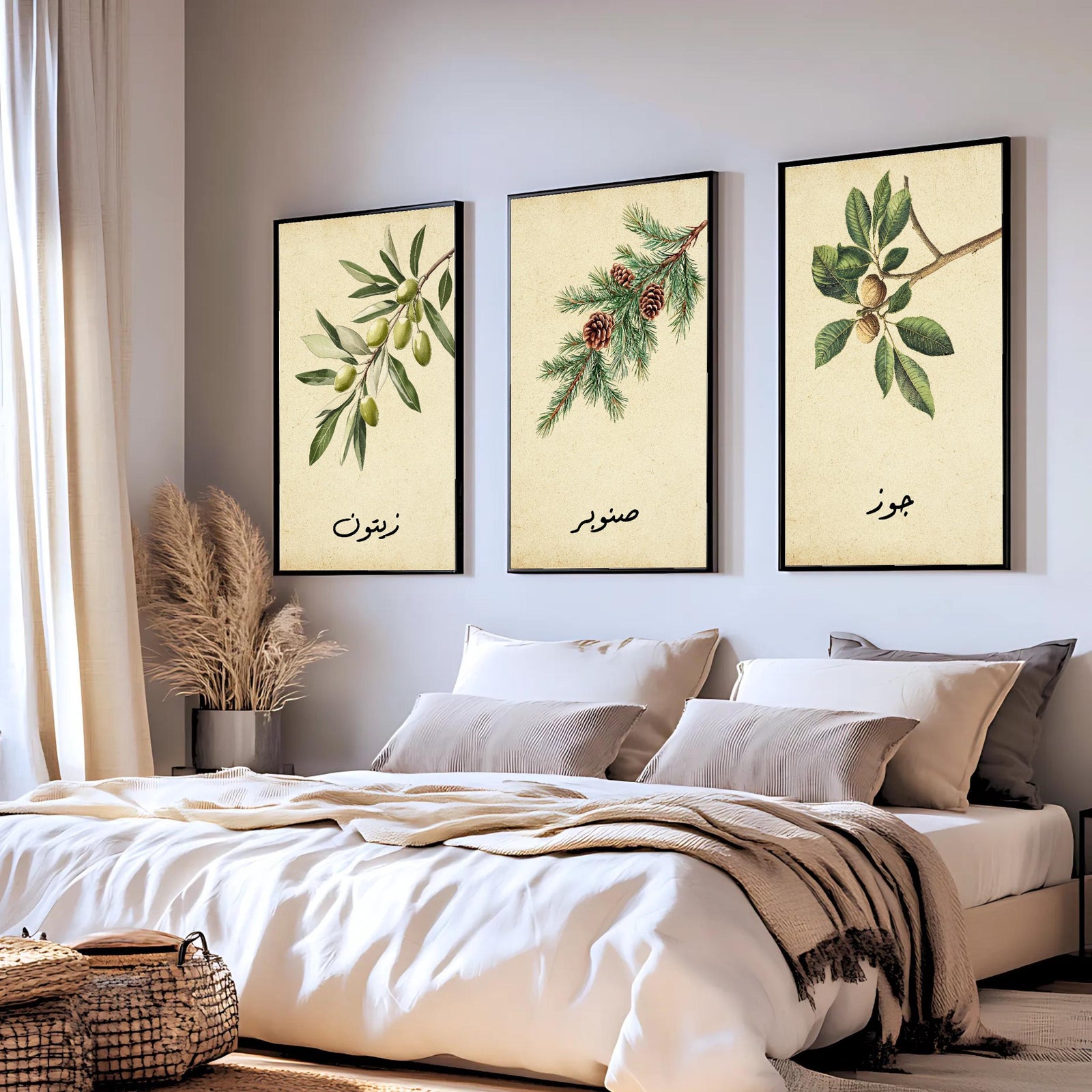 Set of 3 framed canvas triptych featuring botanical illustrations of olive, pine and walnut branches with Arabic calligraphy labels on a warm cream background, displayed above a neutral sofa in a modern living room.