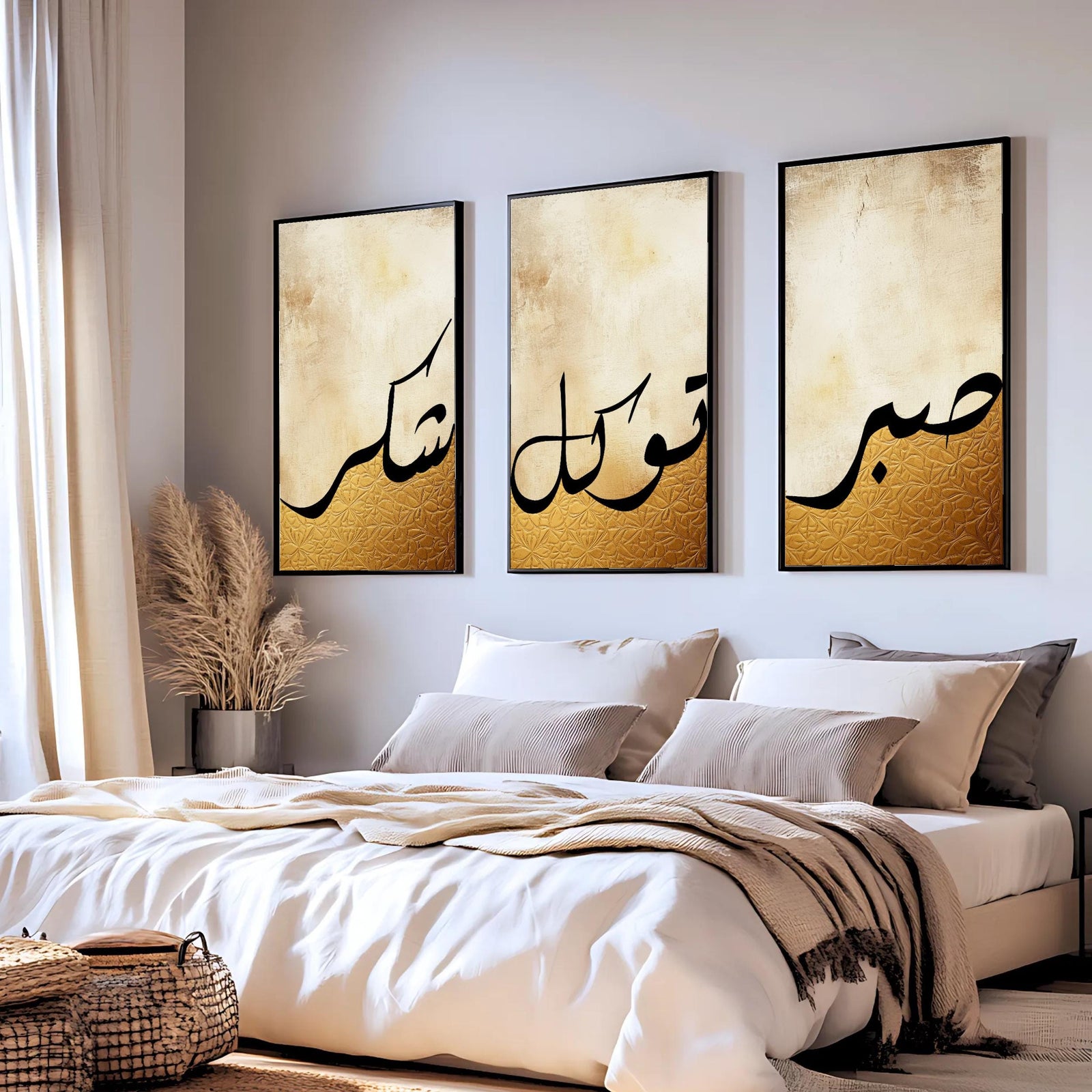 Set of 3 framed canvas triptych featuring Shukr, Tawakkul and Sabr in bold black Arabic calligraphy on a warm amber and cream textured background, displayed above a neutral sofa in a modern living room.