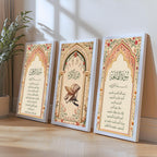 Set of 3 framed canvas triptych featuring Surah Al-Rahman, Al-Quran Al-Kareem and Surah Al-Fatiha in Arabic calligraphy inside floral pink and gold Islamic arches on a warm cream background, displayed above a neutral sofa.