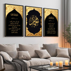 Set of 3 framed canvas triptych featuring Surah Al-Maoun, Muhammad in Arabic calligraphy and Surah Al-Fatiha in gold on dramatic black arch panels with gold textured background, displayed above a neutral sofa.