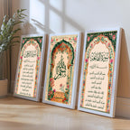 Set of 3 framed canvas triptych with Surah Al-Rahman, large Bismillah calligraphy and Surah Al-Fatiha inside vibrant green and pink Mughal floral arches on a warm cream background, displayed above a neutral sofa.