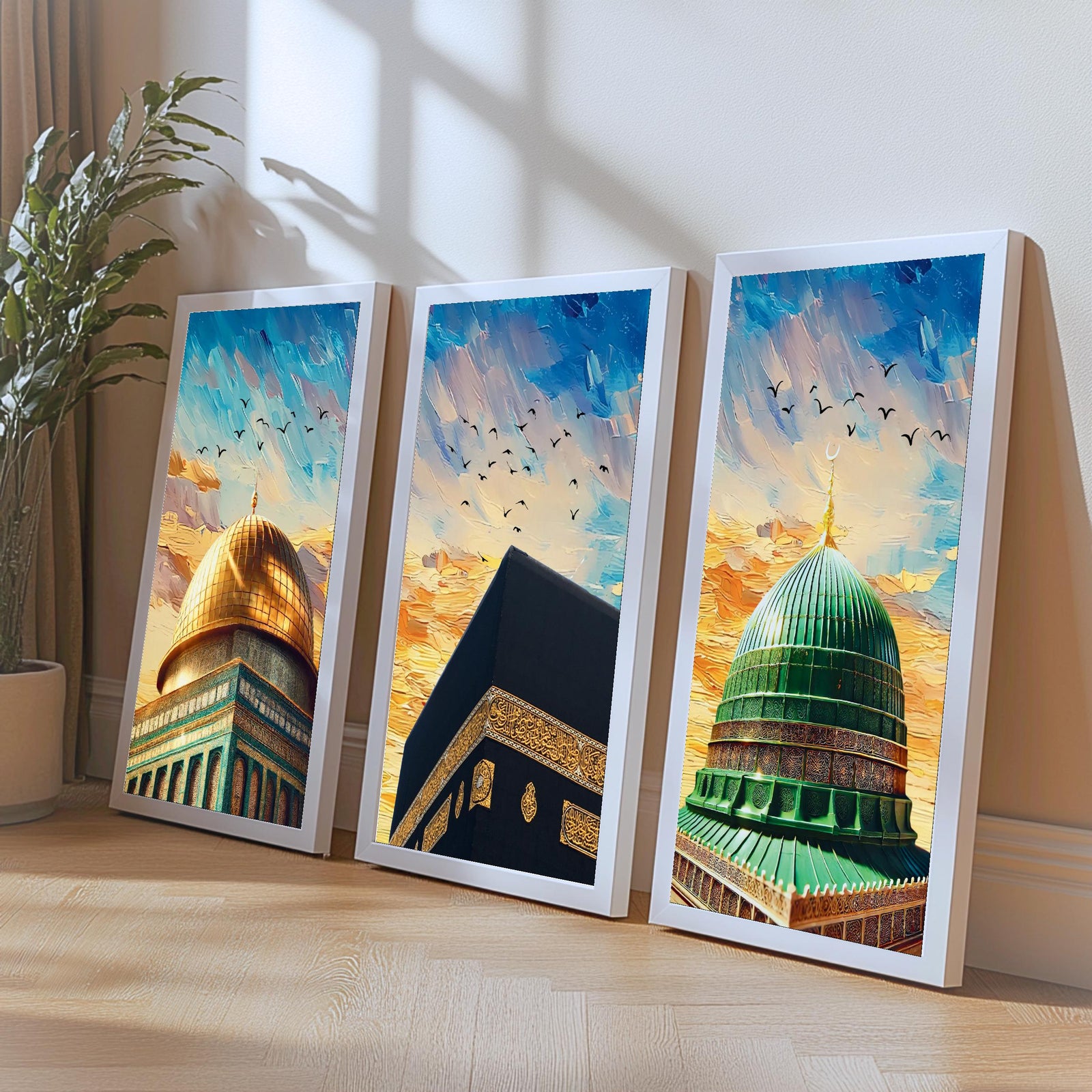 Set of 3 framed canvas triptych showing close-up domes of the Dome of the Rock, Kaaba and Al-Masjid An-Nabawi in bold impressionist brushstrokes with vibrant blue and golden skies and birds in flight.