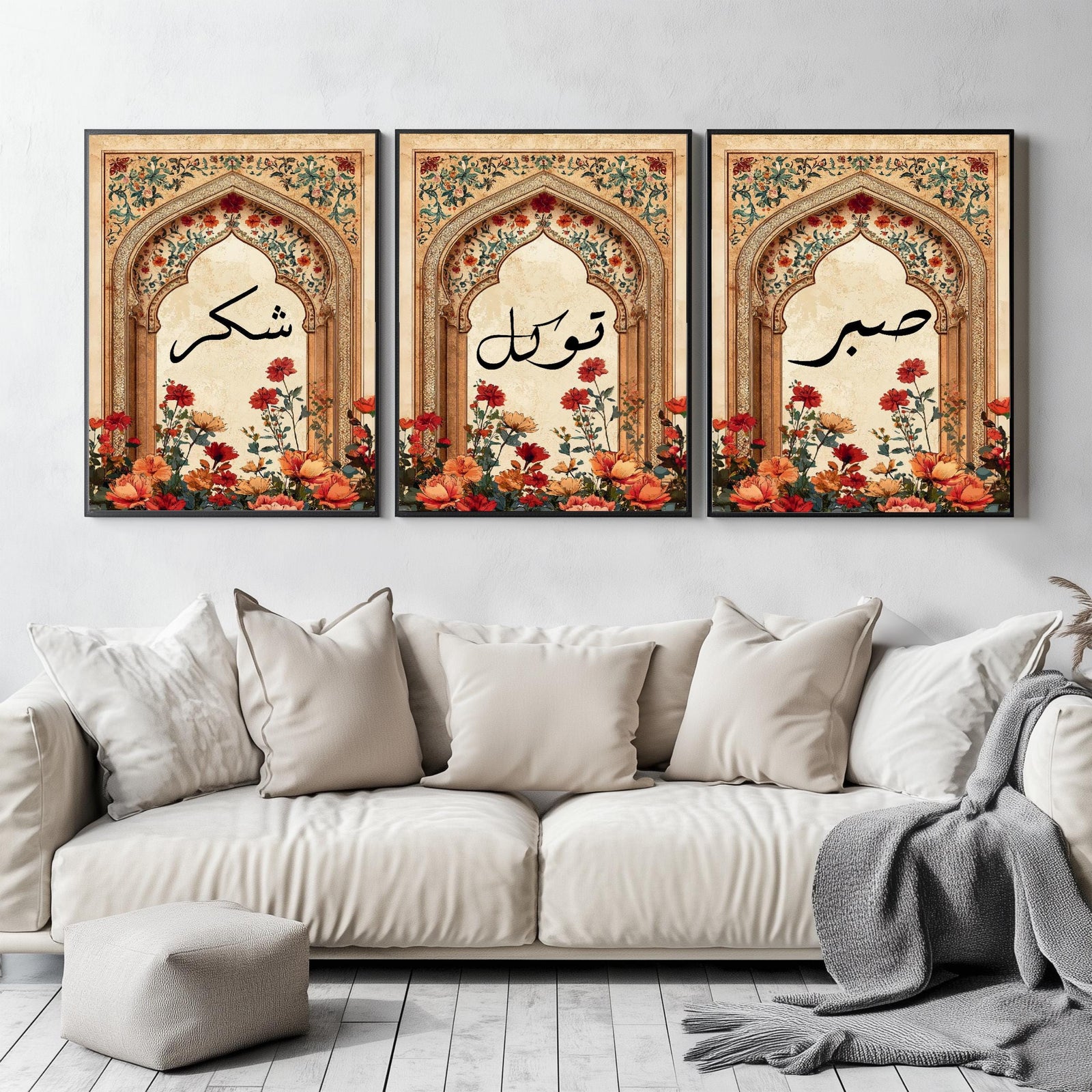 Set of 3 framed canvas triptych featuring Sabr, Shukr and Tawakkul Arabic calligraphy on ornate golden Islamic arches with vibrant floral bouquets in warm tones, displayed above a neutral sofa in a modern living room.