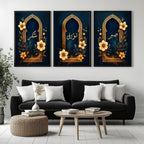 Set of 3 framed canvas triptych with Sabr, Shukr and Tawakkul in gold Arabic calligraphy inside ornate navy and gold Islamic arches surrounded by yellow and dark blue flowers, displayed above a grey sofa.