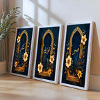 Set of 3 framed canvas triptych with Sabr, Shukr and Tawakkul in gold Arabic calligraphy inside ornate navy and gold Islamic arches surrounded by yellow and dark blue flowers, displayed above a grey sofa.