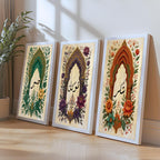 Set of 3 framed canvas triptych with Sabr, Tawakkul and Shukr in Arabic calligraphy inside green, purple and terracotta Mughal arches surrounded by intricate botanical florals on a cream parchment background.