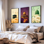 Set of 3 framed canvas triptych showing the Kaaba, Dome of the Rock and Al-Masjid An-Nabawi with oversized peony flowers and birds in flight, each panel on a distinct yellow, purple and green background.
