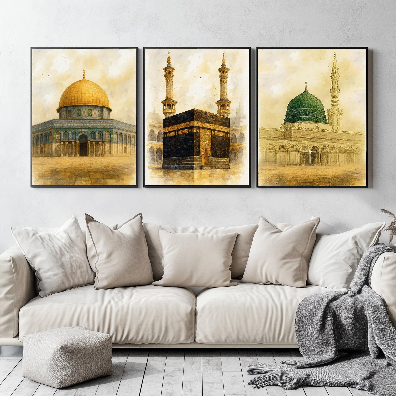 Set of 3 framed canvas triptych depicting the Dome of the Rock, the Kaaba and Al-Masjid An-Nabawi in a soft antique sepia and gold manuscript style, displayed above a neutral sofa in a modern living room.