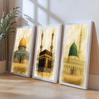 Set of 3 framed canvas triptych depicting the Dome of the Rock, the Kaaba and Al-Masjid An-Nabawi in a soft antique sepia and gold manuscript style, displayed above a neutral sofa in a modern living room.