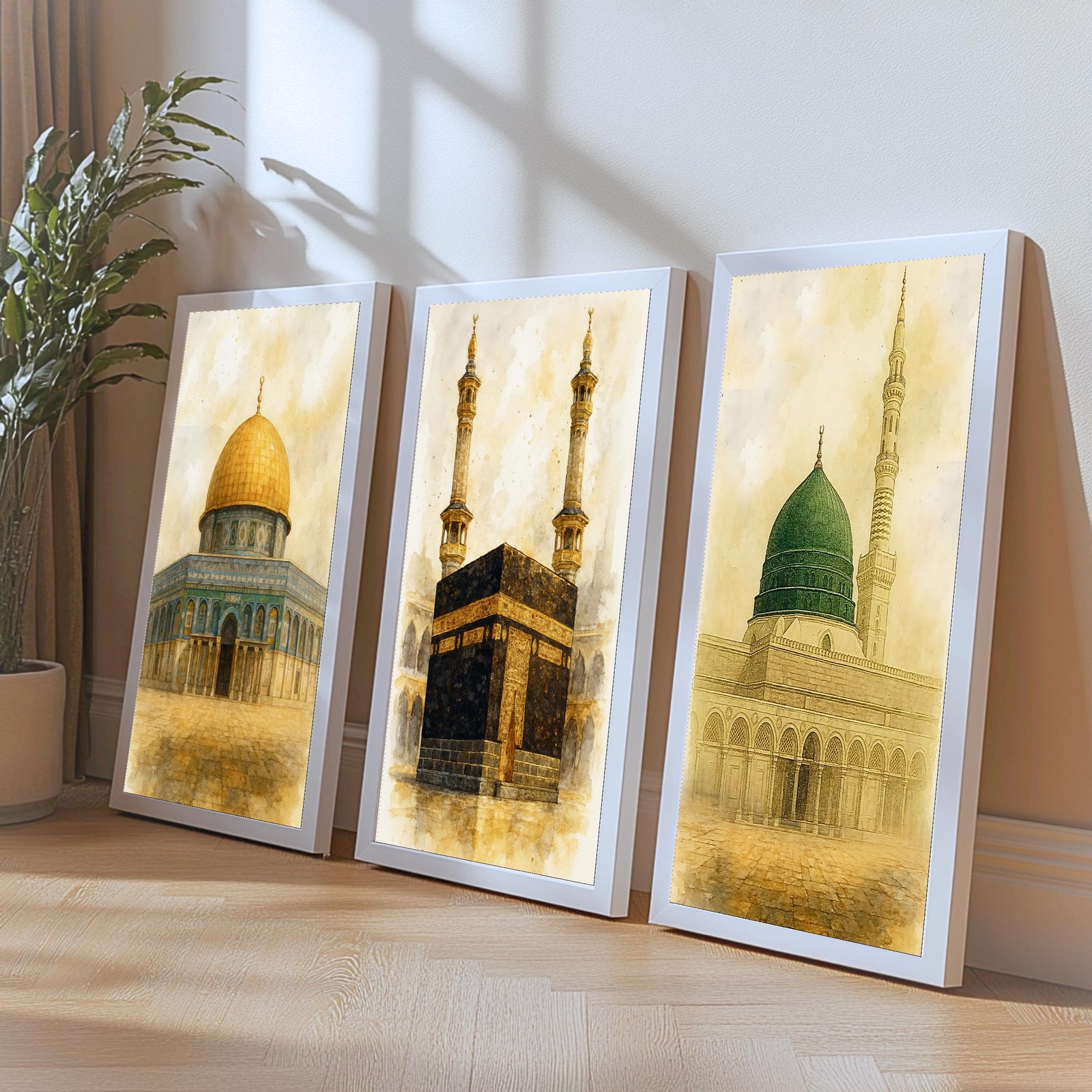Set of 3 framed canvas triptych depicting the Dome of the Rock, the Kaaba and Al-Masjid An-Nabawi in a soft antique sepia and gold manuscript style, displayed above a neutral sofa in a modern living room.
