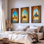 Set of 3 framed canvas triptych showing Al-Masjid An-Nabawi, the Kaaba and the Dome of the Rock viewed through realistic rustic sandstone arches with cobblestone courtyards under a bright blue sky, displayed above a neutral sofa.