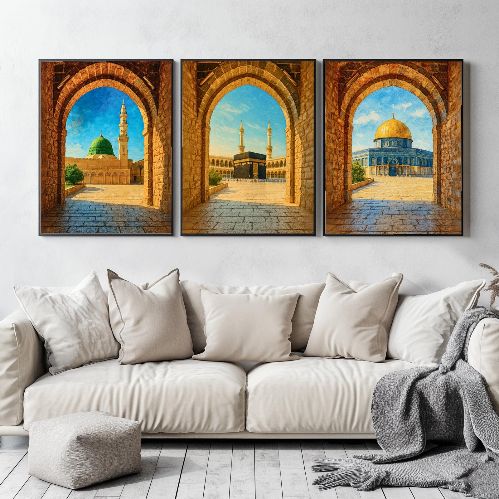 Set of 3 framed canvas triptych showing Al-Masjid An-Nabawi, the Kaaba and the Dome of the Rock viewed through realistic rustic sandstone arches with cobblestone courtyards under a bright blue sky, displayed above a neutral sofa.