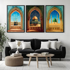 Set of 3 framed canvas triptych showing the Kaaba, Dome of the Rock and Al-Masjid An-Nabawi framed through ornate Islamic arches in rich watercolor teal, blue and gold tones, displayed above a neutral sofa.