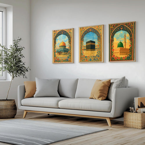 Set of 3 framed canvas triptych depicting Al-Masjid An-Nabawi, the Kaaba and the Dome of the Rock in warm golden mosaic style with vibrant floral arch borders, displayed above a neutral sofa.