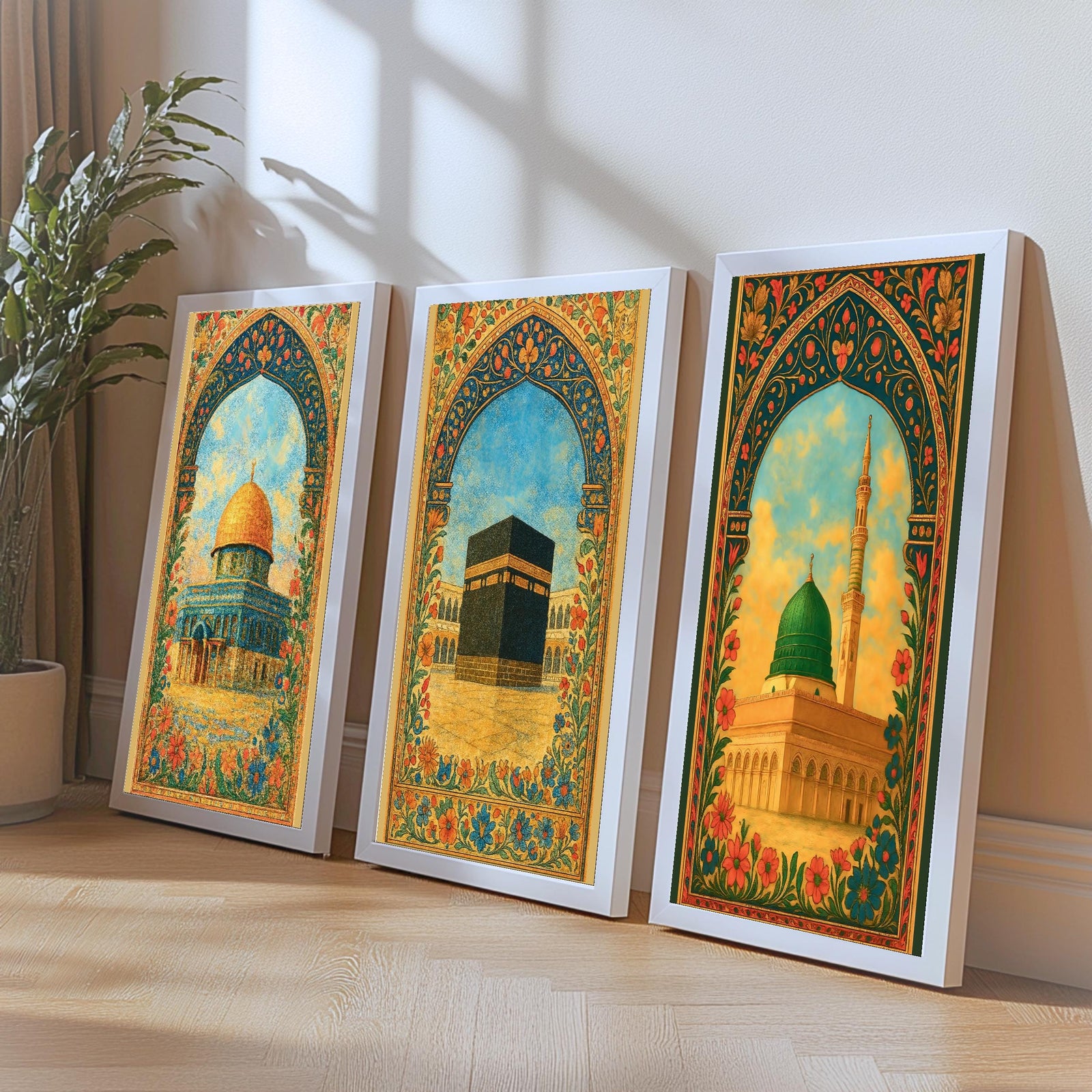 Set of 3 framed canvas triptych depicting Al-Masjid An-Nabawi, the Kaaba and the Dome of the Rock in warm golden mosaic style with vibrant floral arch borders, displayed above a neutral sofa.