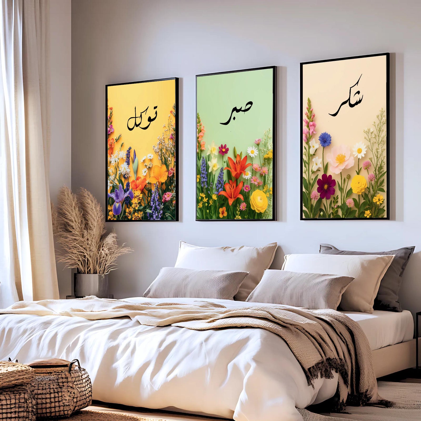 Set of 3 framed canvas triptych with Tawakkul, Sabr and Shukr in Arabic calligraphy above vibrant wildflower gardens on pastel yellow, green and peach backgrounds, displayed above a neutral sofa.