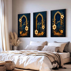 Set of 3 framed canvas triptych with Sabr, Shukr and Tawakkul in gold Arabic calligraphy inside ornate navy and gold Islamic arches surrounded by yellow and dark blue flowers, displayed above a grey sofa.