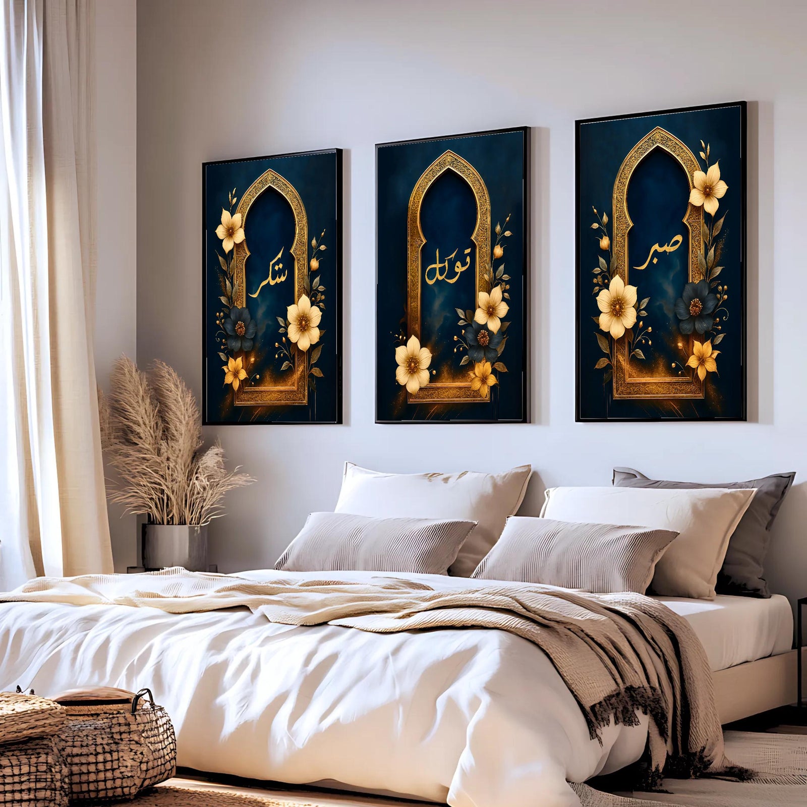 Set of 3 framed canvas triptych with Sabr, Shukr and Tawakkul in gold Arabic calligraphy inside ornate navy and gold Islamic arches surrounded by yellow and dark blue flowers, displayed above a grey sofa.
