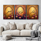 Set of 3 framed canvas triptych with Sabr, Shukr and Tawakkul Arabic calligraphy inside golden Islamic arches, rich red and amber tones with painted roses, displayed on a warm neutral wall above a grey sofa.