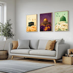 Set of 3 framed canvas triptych showing the Kaaba, Dome of the Rock and Al-Masjid An-Nabawi with oversized peony flowers and birds in flight, each panel on a distinct yellow, purple and green background.