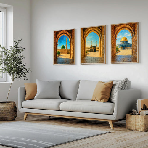 Set of 3 framed canvas triptych showing Al-Masjid An-Nabawi, the Kaaba and the Dome of the Rock viewed through realistic rustic sandstone arches with cobblestone courtyards under a bright blue sky, displayed above a neutral sofa.