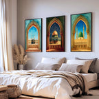 Set of 3 framed canvas triptych showing the Kaaba, Dome of the Rock and Al-Masjid An-Nabawi framed through ornate Islamic arches in rich watercolor teal, blue and gold tones, displayed above a neutral sofa.