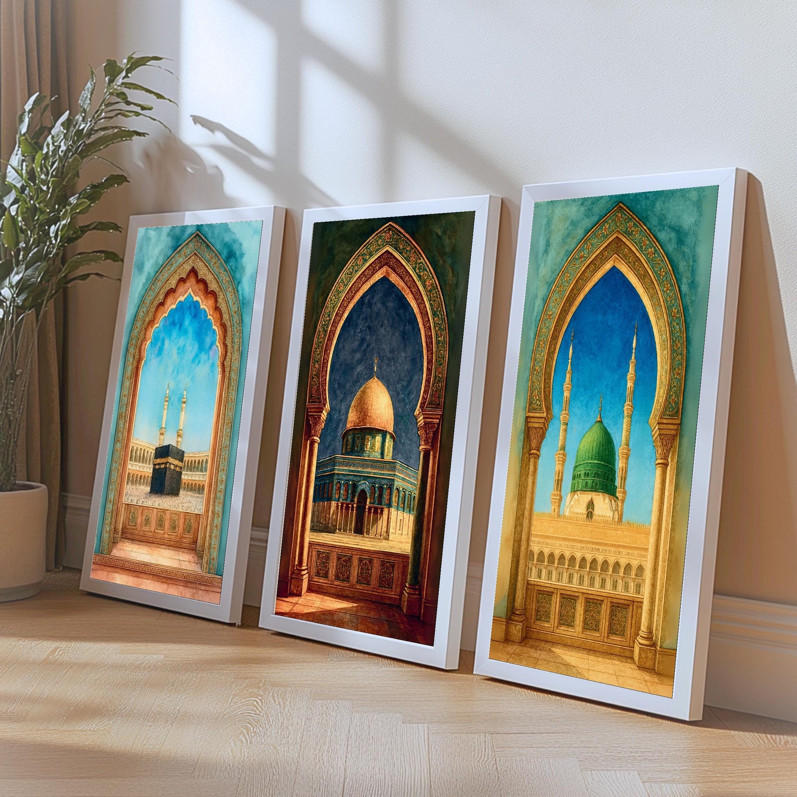 Set of 3 framed canvas triptych showing the Kaaba, Dome of the Rock and Al-Masjid An-Nabawi framed through ornate Islamic arches in rich watercolor teal, blue and gold tones, displayed above a neutral sofa.