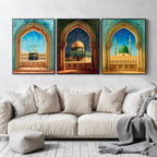 Set of 3 framed canvas triptych showing the Kaaba, Dome of the Rock and Al-Masjid An-Nabawi framed through ornate Islamic arches in rich watercolor teal, blue and gold tones, displayed above a neutral sofa.