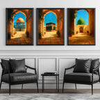Set of 3 framed canvas triptych depicting the Dome of the Rock, the Kaaba and Al-Masjid An-Nabawi viewed through warm stone arches in a rich painterly style, displayed above a neutral sofa in a modern living room.