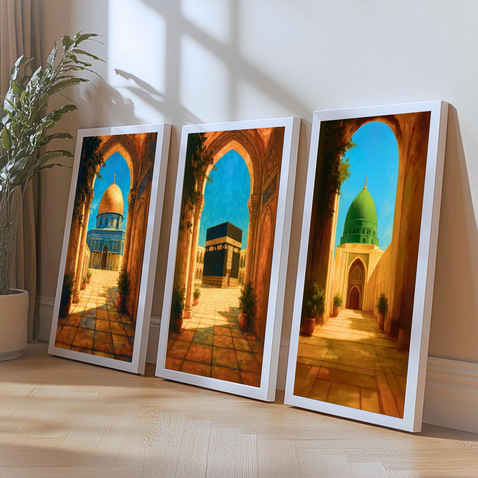 Set of 3 framed canvas triptych depicting the Dome of the Rock, the Kaaba and Al-Masjid An-Nabawi viewed through warm stone arches in a rich painterly style, displayed above a neutral sofa in a modern living room.