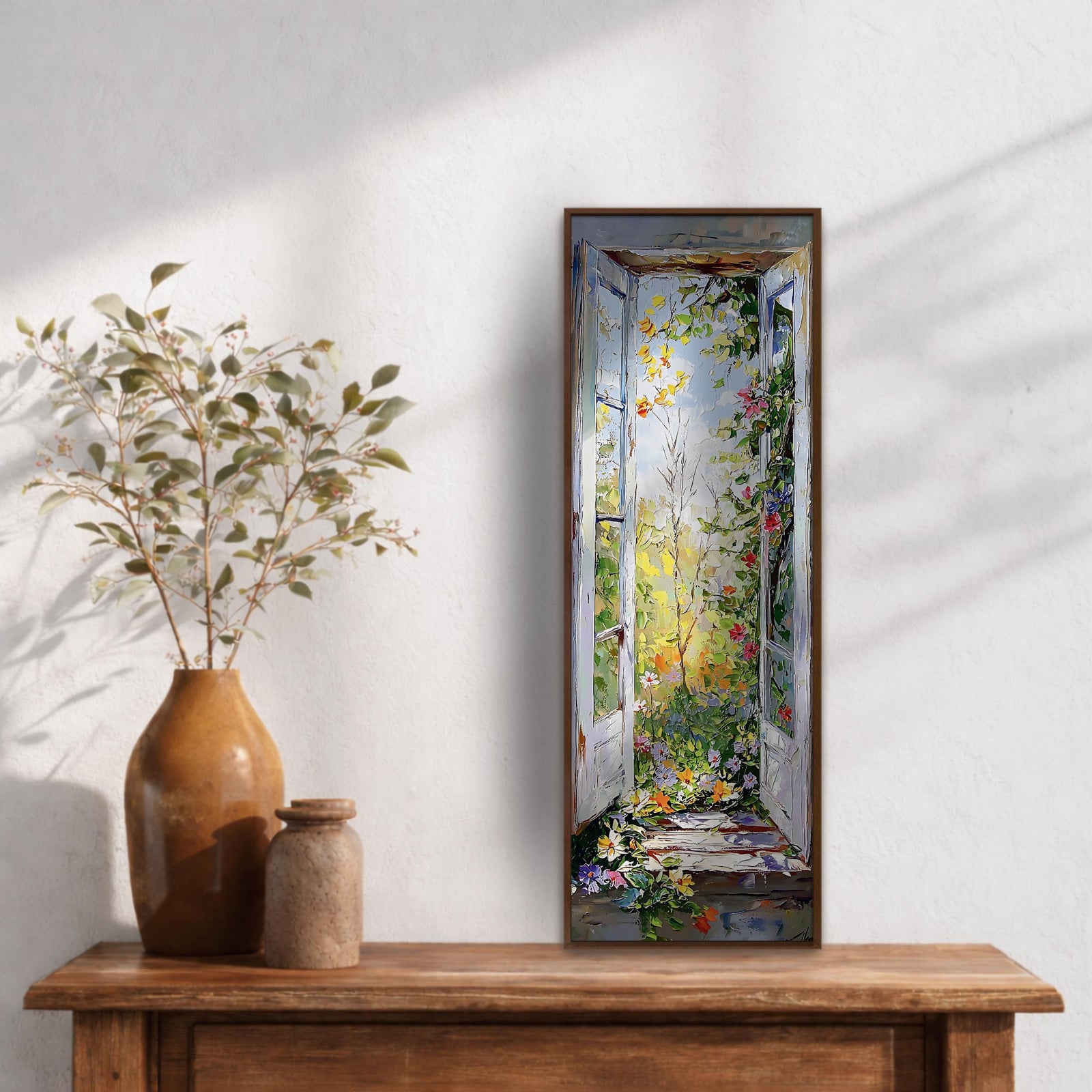 Long vertical painting of an open garden window with white shutters revealing a sunlit countryside filled with colorful flowers and climbing greenery. Sunlight filters through leaves and blossoms beyond the opening while expressive brushstrokes create a bright floral outdoor scene framed by rustic shutters.