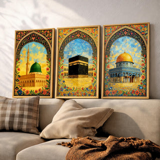 Set of 3 framed canvas triptych depicting Al-Masjid An-Nabawi, the Kaaba and the Dome of the Rock in warm golden mosaic style with vibrant floral arch borders, displayed above a neutral sofa.