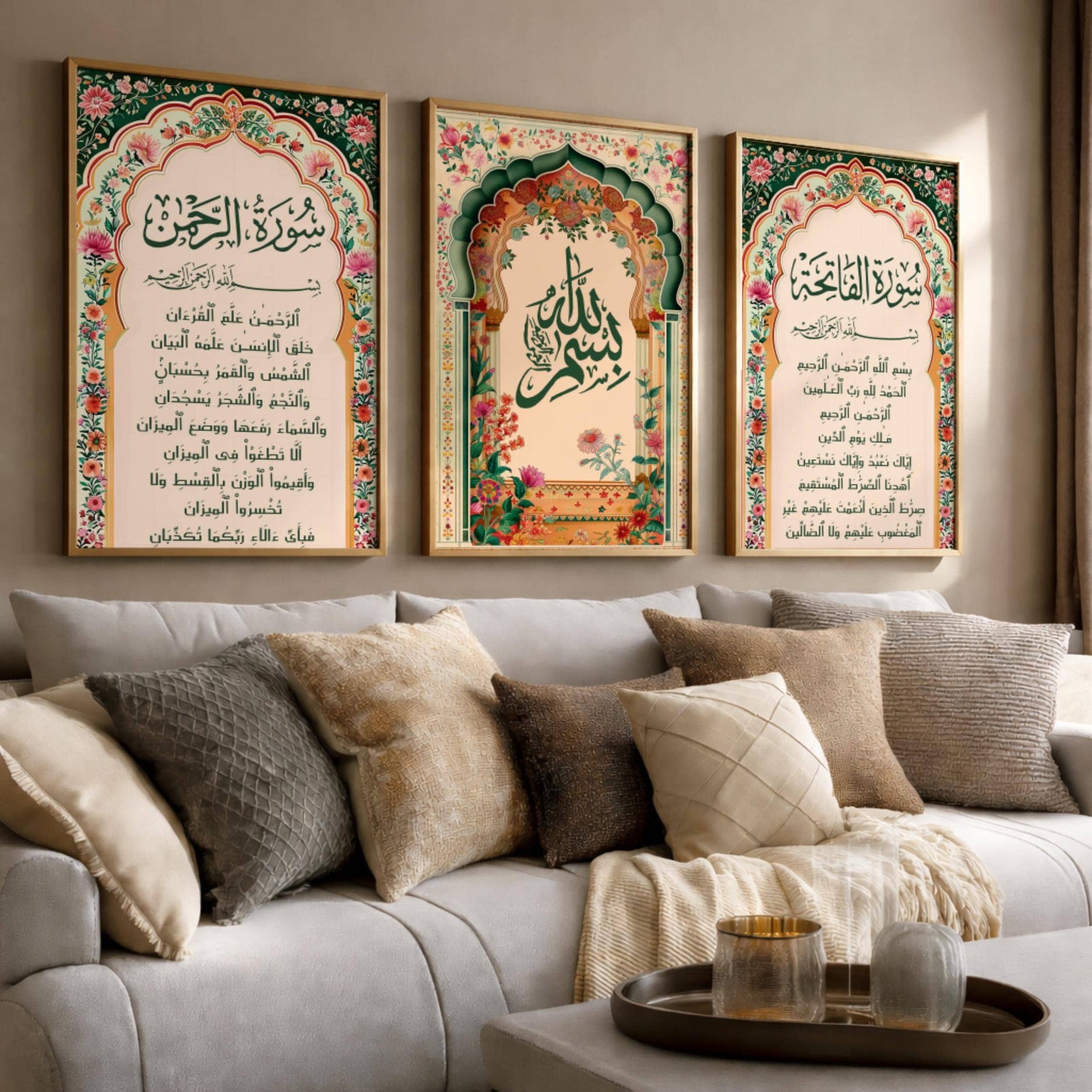 Set of 3 framed canvas triptych with Surah Al-Rahman, large Bismillah calligraphy and Surah Al-Fatiha inside vibrant green and pink Mughal floral arches on a warm cream background, displayed above a neutral sofa.