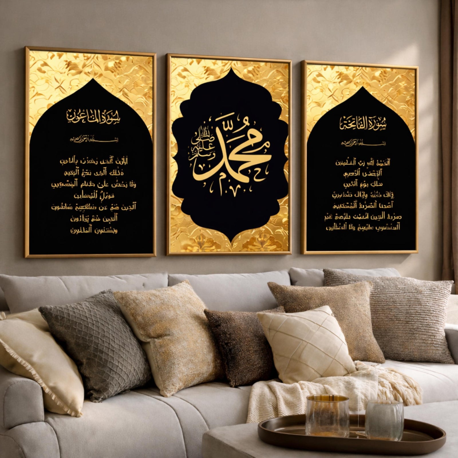 Set of 3 framed canvas triptych featuring Surah Al-Maoun, Muhammad in Arabic calligraphy and Surah Al-Fatiha in gold on dramatic black arch panels with gold textured background, displayed above a neutral sofa.