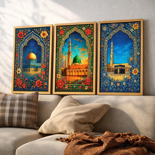 Set of 3 framed canvas triptych showing the Dome of the Rock, Al-Masjid An-Nabawi and Masjid Al-Haram inside ornate floral Islamic arches in rich blue and gold tones, displayed above a neutral sofa.