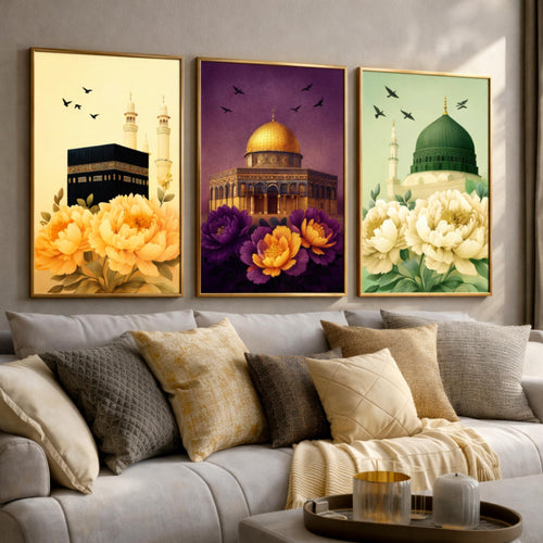 Set of 3 framed canvas triptych showing the Kaaba, Dome of the Rock and Al-Masjid An-Nabawi with oversized peony flowers and birds in flight, each panel on a distinct yellow, purple and green background.