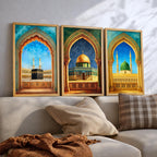 Set of 3 framed canvas triptych showing the Kaaba, Dome of the Rock and Al-Masjid An-Nabawi framed through ornate Islamic arches in rich watercolor teal, blue and gold tones, displayed above a neutral sofa.