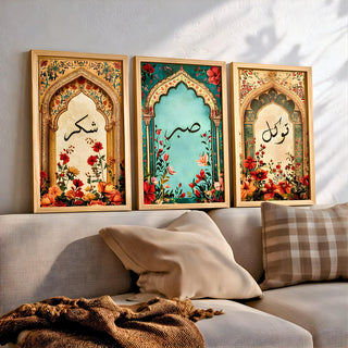 Set of 3 framed canvas triptych with Shukr, Sabr and Tawakkul in Arabic calligraphy inside gold, teal and vintage arches surrounded by lush red and orange Persian garden floral blooms, displayed above a neutral sofa.
