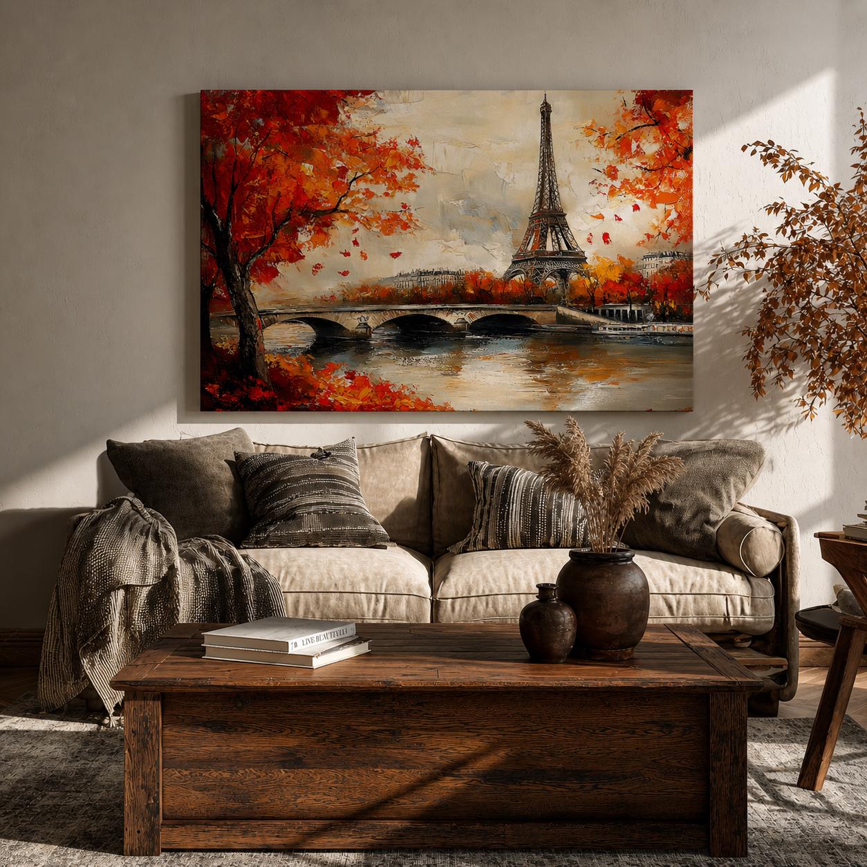 A framed canvas painting of the Eiffel Tower in Paris featuring a stone bridge over a river with autumn trees in vibrant red and orange foliage. The artwork captures the iconic Paris landmark with impressionistic brush strokes and a warm, naturalistic style emphasizing the cityscape and seasonal atmosphere.