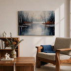 A framed canvas painting depicting a serene winter lake landscape with bare trees reflected in still water. The scene features a quiet woodland setting with leafless trees and subtle earthy tones, capturing the calm and reflective nature of a winter forest by the lake.