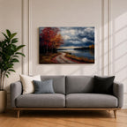 A framed canvas painting depicting an autumn landscape with a winding path along a riverbank, bordered by trees with vibrant fall foliage. The scene captures a moody sky with clouds, rendered in a vintage style emphasizing texture and rich colors.