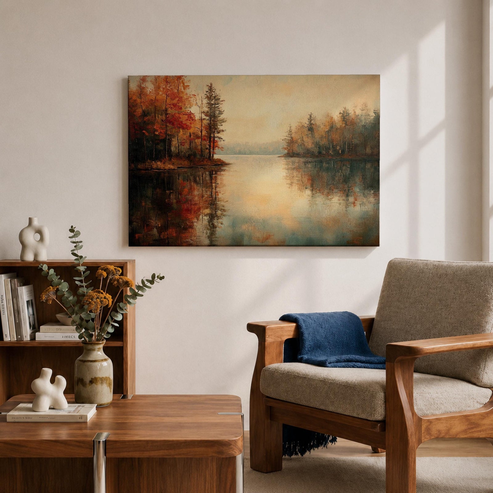 An oil painting of a serene autumn lake scene featuring calm water reflecting trees with vibrant fall foliage in shades of red and orange. The vintage style artwork captures a peaceful lakeside landscape with detailed trees on both sides and a soft, muted sky in the background.