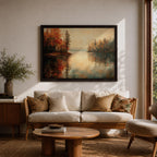 An oil painting of a serene autumn lake scene featuring calm water reflecting trees with vibrant fall foliage in shades of red and orange. The vintage style artwork captures a peaceful lakeside landscape with detailed trees on both sides and a soft, muted sky in the background.