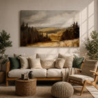 A framed canvas painting depicting a wildflower meadow landscape with rolling hills and clusters of trees under a cloudy sky. The artwork captures a natural countryside scene with detailed brushwork and a warm, rustic atmosphere emphasizing the beauty of open fields and forest edges.