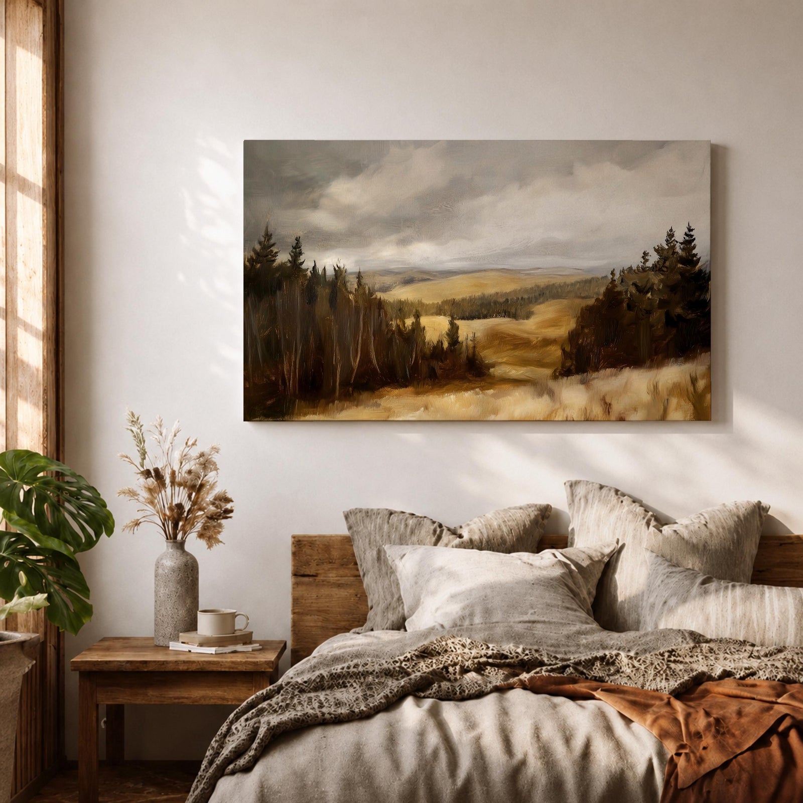 A framed canvas painting depicting a wildflower meadow landscape with rolling hills and clusters of trees under a cloudy sky. The artwork captures a natural countryside scene with detailed brushwork and a warm, rustic atmosphere emphasizing the beauty of open fields and forest edges.
