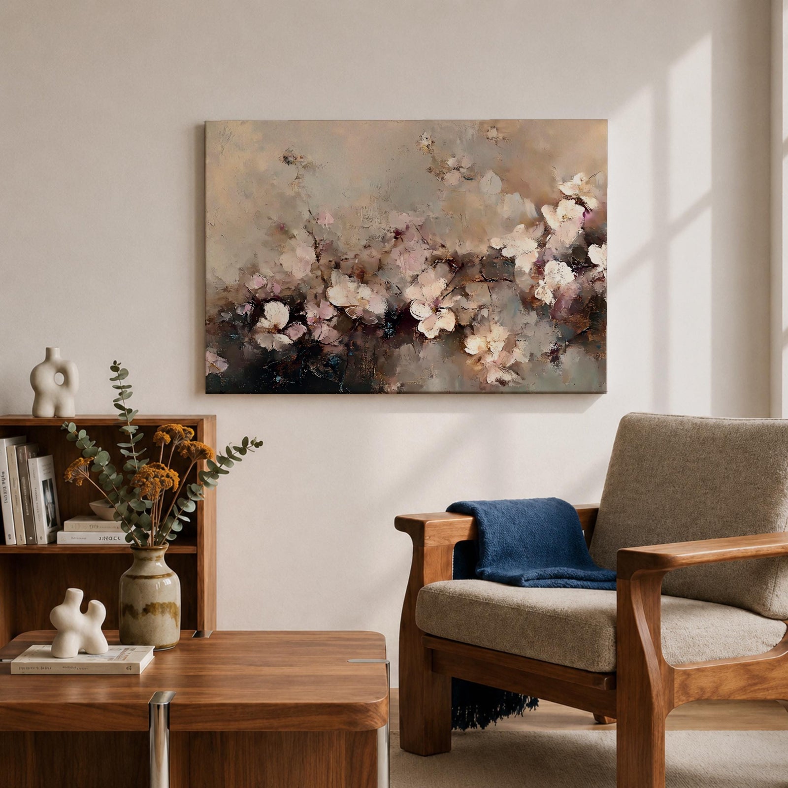 An abstract framed canvas artwork depicting cherry blossom flowers in soft, blurred tones with textured brush strokes creating a delicate floral composition that evokes the beauty of spring blooms in a modern artistic style.